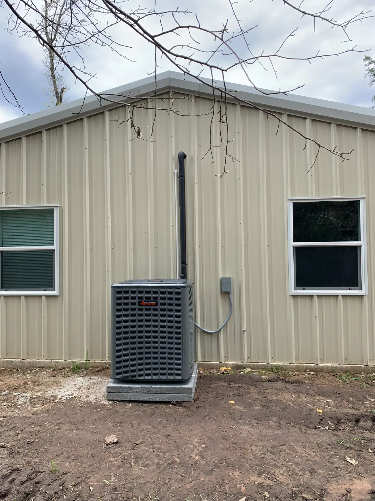 HVAC technician installing an air conditioning system, highlighting AC installation services in Plantersville, TX by Big State AC & Heating
