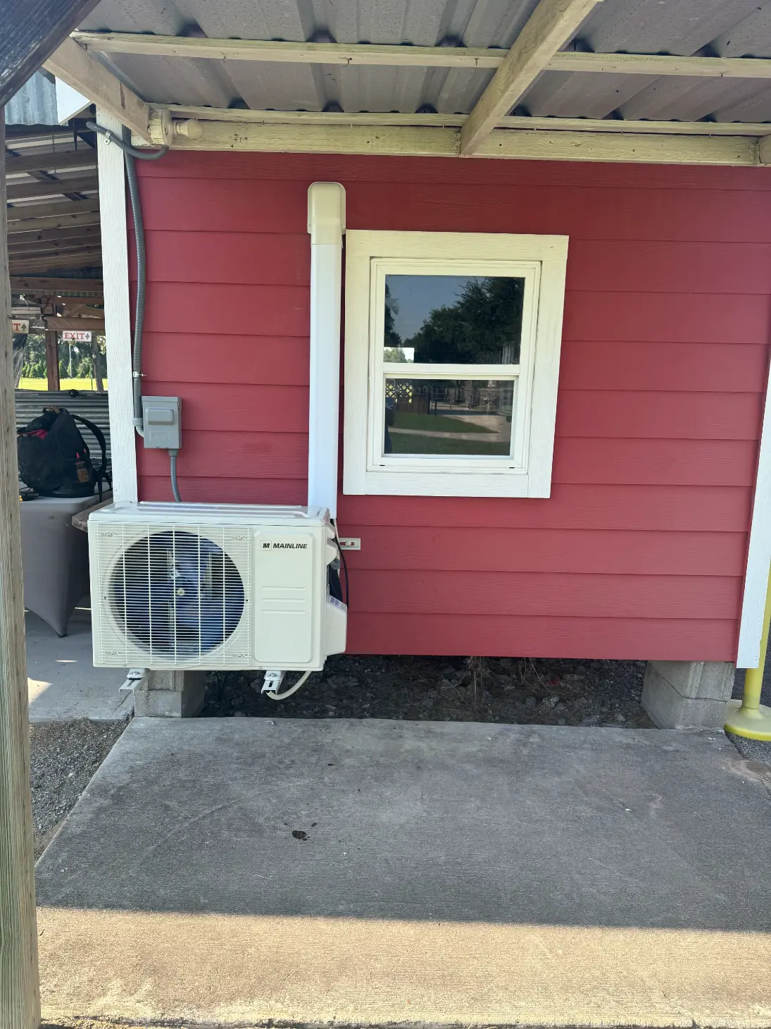 Employee holding HVAC equipment for professional AC repair and heating services in Plantersville, TX